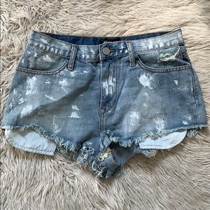 Jean shorts with paint splatter